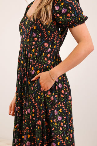 Floral maxi dress, V neckline, black base, puffy sleeves, with pockets, lower back cutout