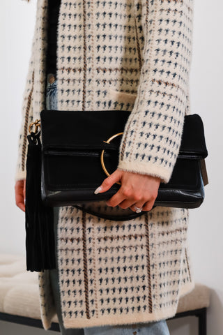 purse, clutch bags, black purse, black clutch bag, black and gold purse, dolce vita purse, black dolce vita purse, dolce vita clutch, black dolce vita clutch