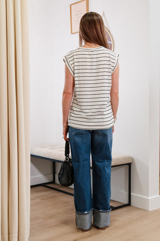 black and white striped top, cuffed blue jeans, black mini purse, everyday outfit