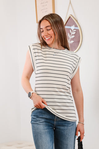 black and white striped top, cuffed blue jeans, black mini purse, everyday outfit