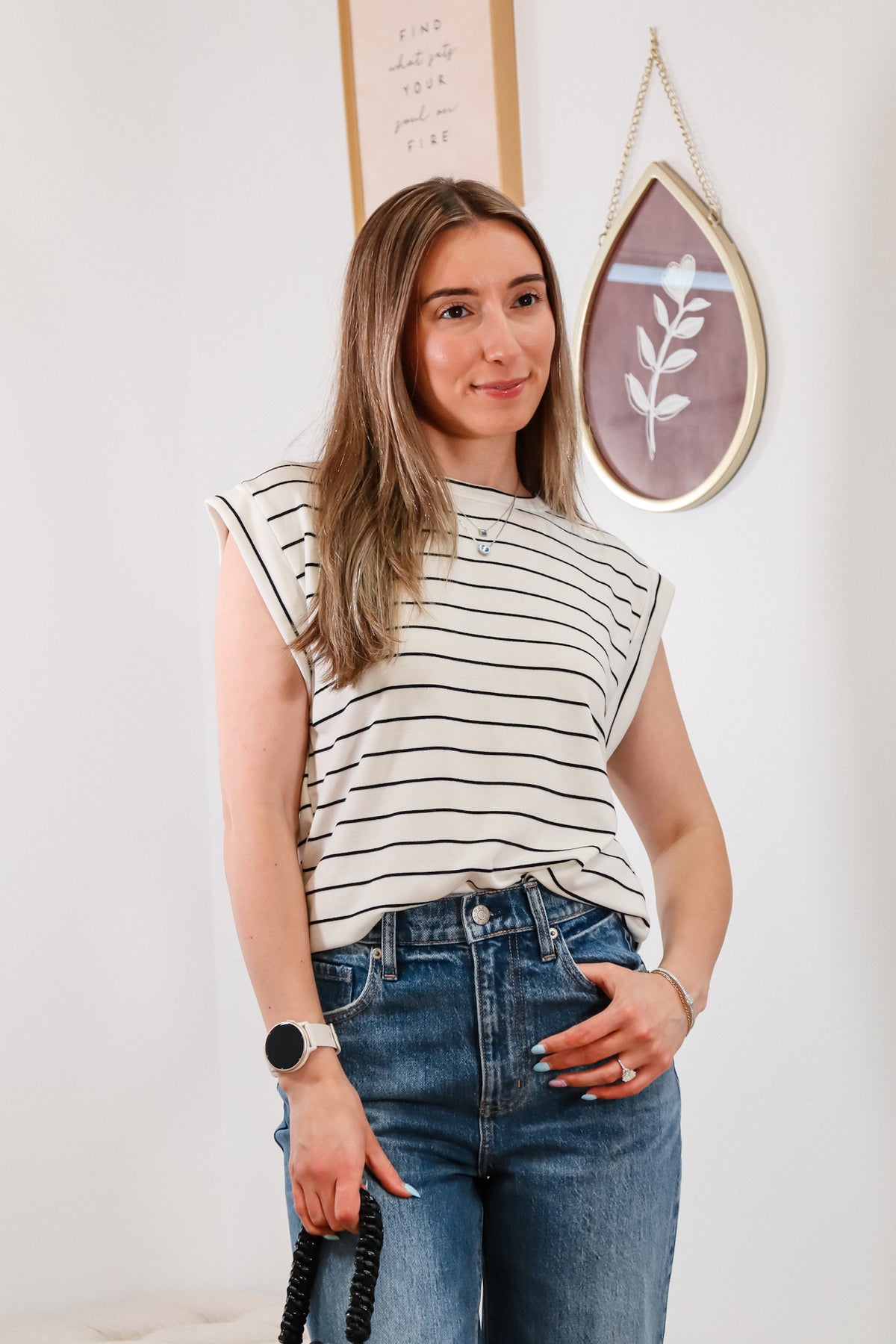 black and white striped top, cuffed blue jeans, black mini purse, everyday outfit