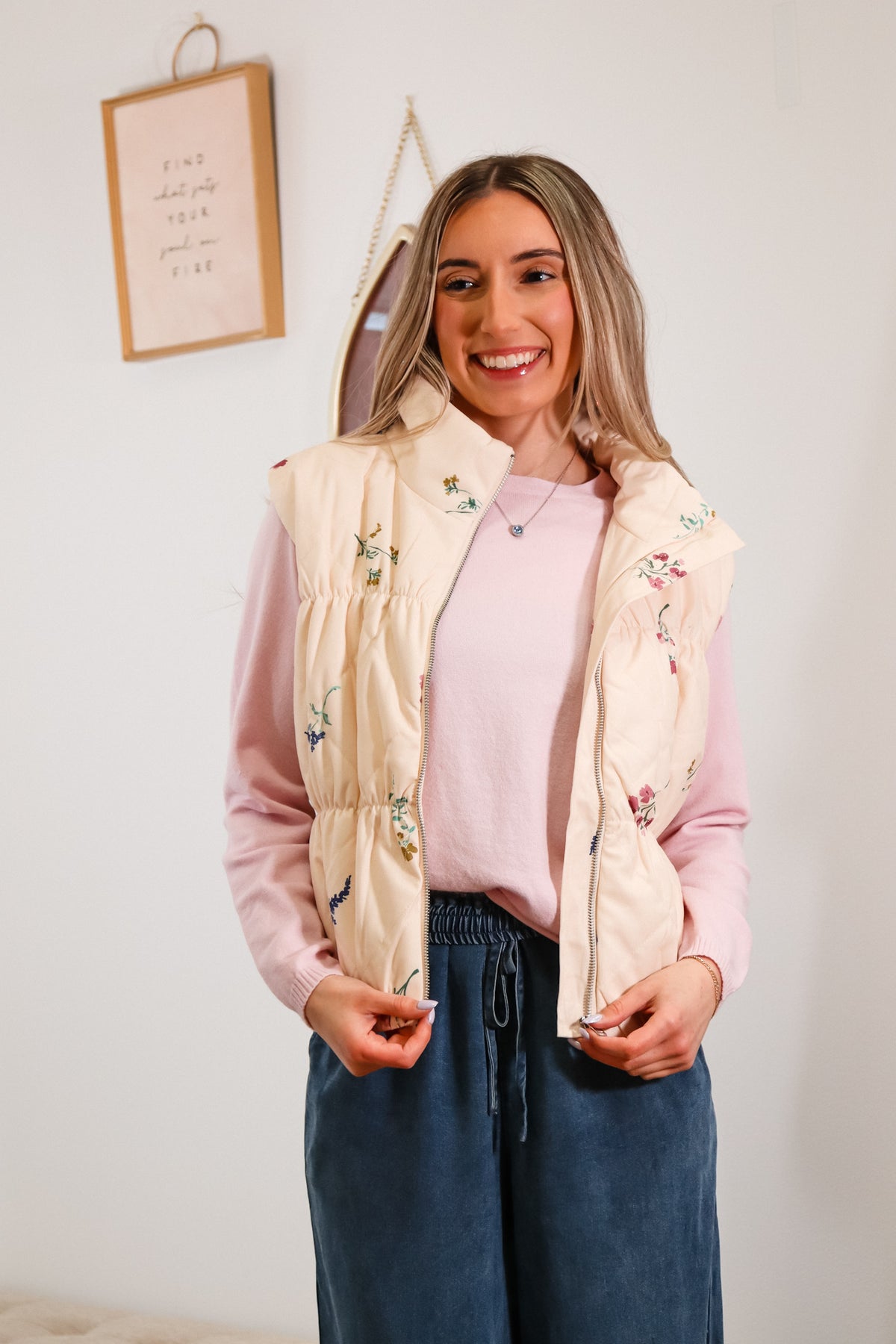 cream zip up vest with wildflower print all over it, super soft fabric