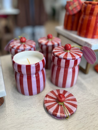 red and pink striped candle, peppermint christmas scent, cute jar