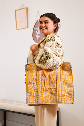 yellow quilted tote bag with zipper closure