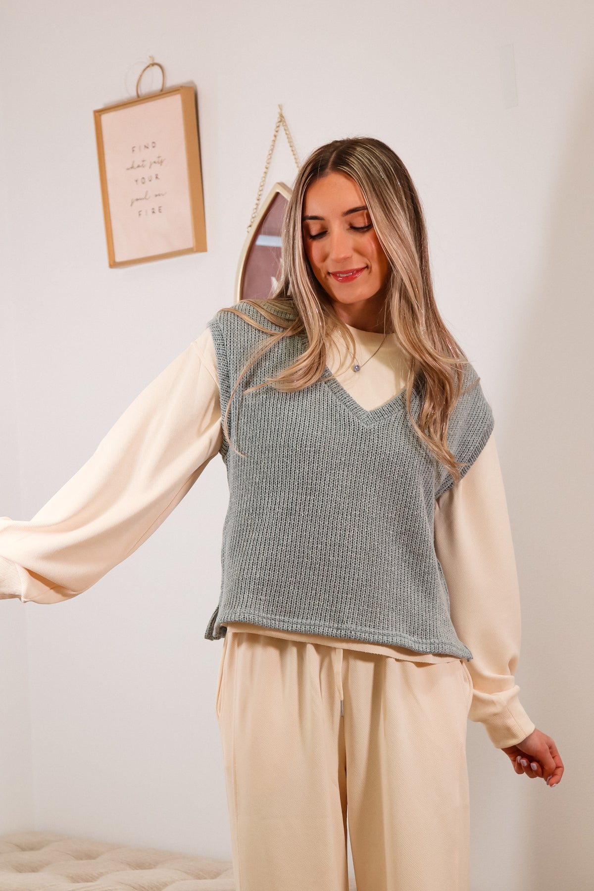 light grey sweater vest with v-neckline