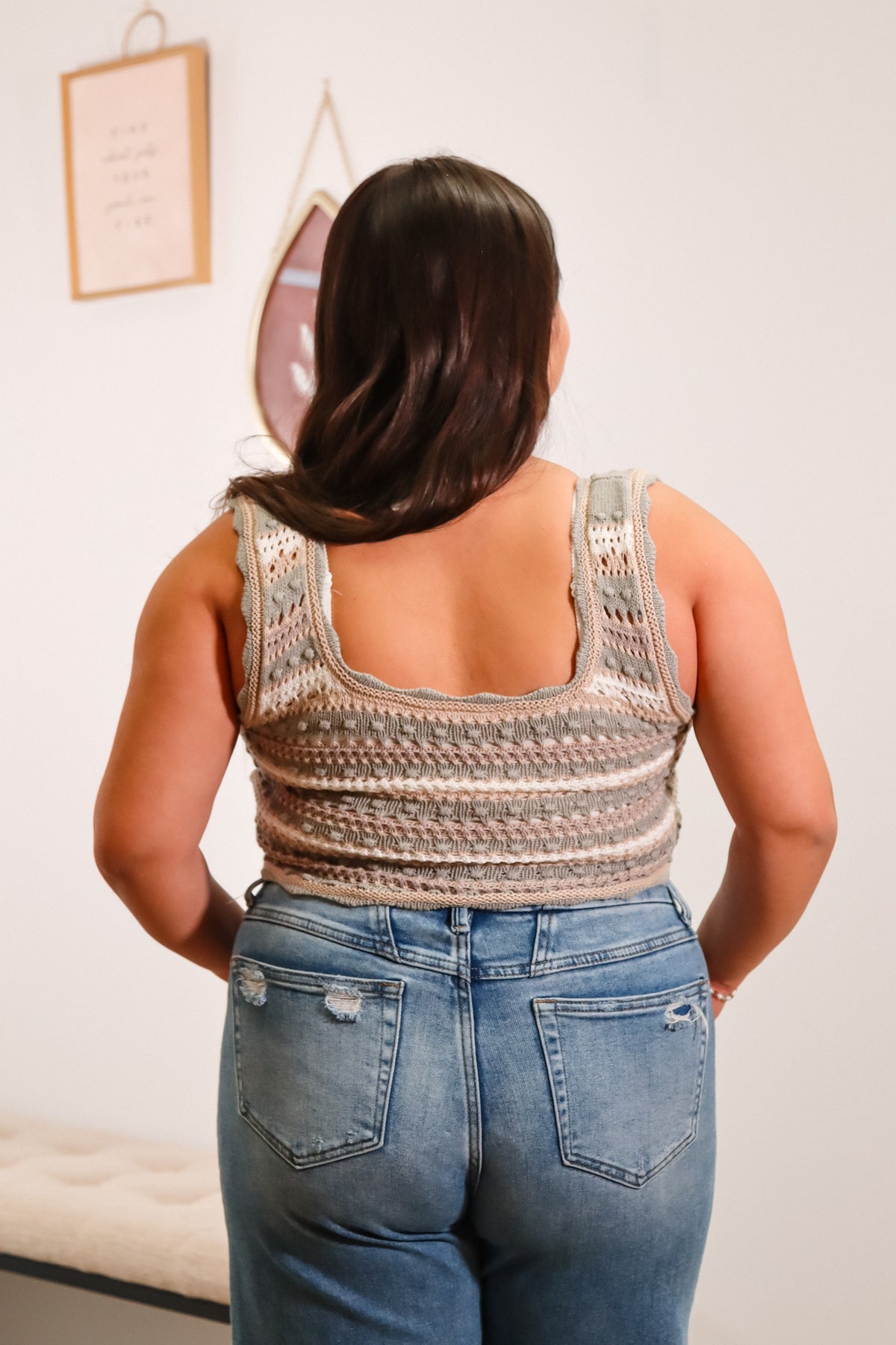 multi color knit tank top with a scoop neckline and curved hemlined, cropped length with scallop edges