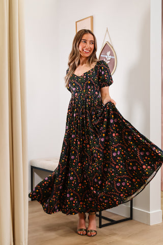 Floral maxi dress, V neckline, black base, puffy sleeves, with pockets, lower back cutout