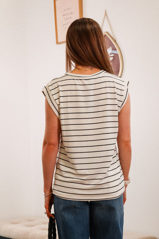 black and white striped top, cuffed blue jeans, black mini purse, everyday outfit