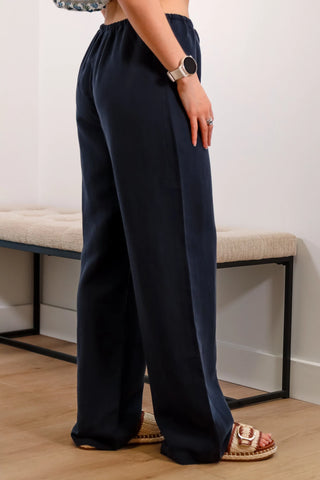 Navy linen pants, summer abroad outfit inspo, outfit inspo, navy pants, summery pants, spring pants, casual navy pants.