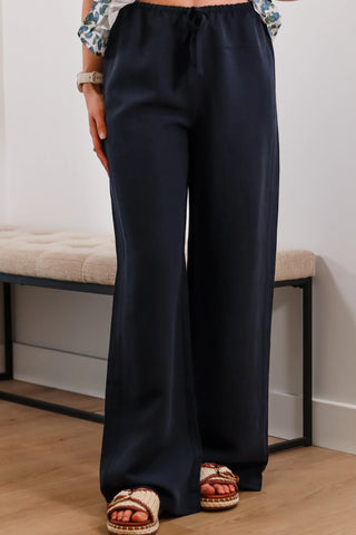 Navy linen pants, summer abroad outfit inspo, outfit inspo, navy pants, summery pants, spring pants, casual navy pants.