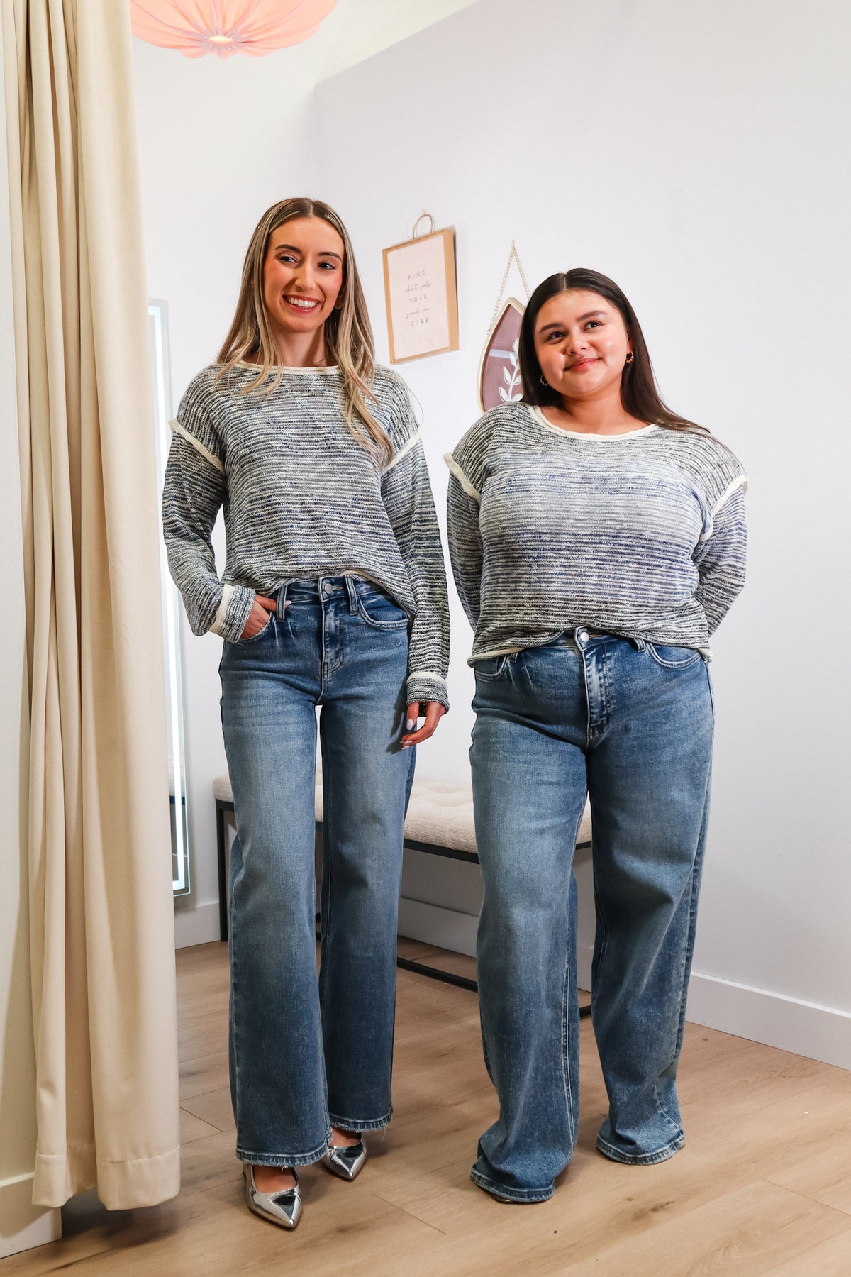 blue, white, and black knit long sleeve top with white contrast trim