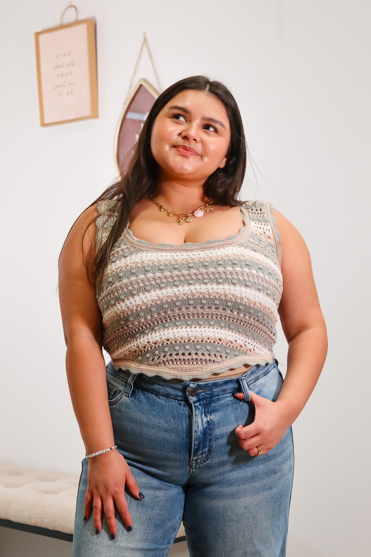 multi color knit tank top with a scoop neckline and curved hemlined, cropped length with scallop edges