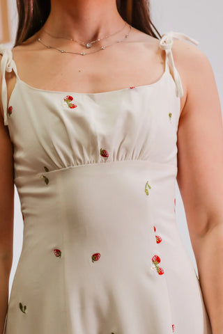 midi strawberry dress, strawberry dress, white dress wither strawberries on it, picnic dress, spring dress, graduations dress inspo, white dress with tie straps 